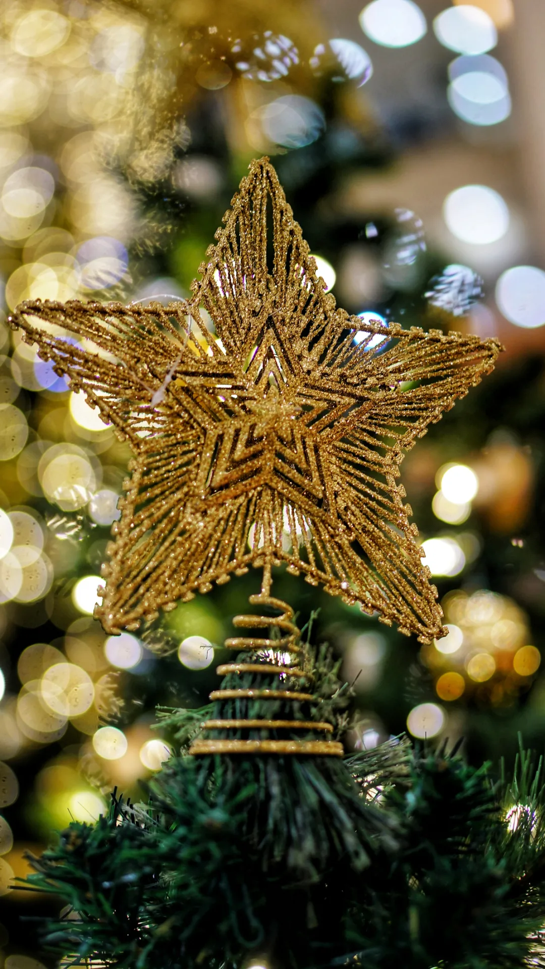 Mum puts together Christmas star decorations using eight paper bags 