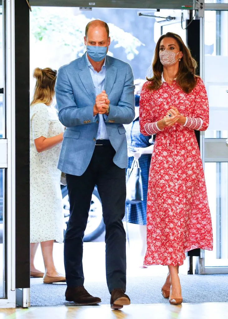 Duchess of Cambridge meets prize winners in pink shirt dress