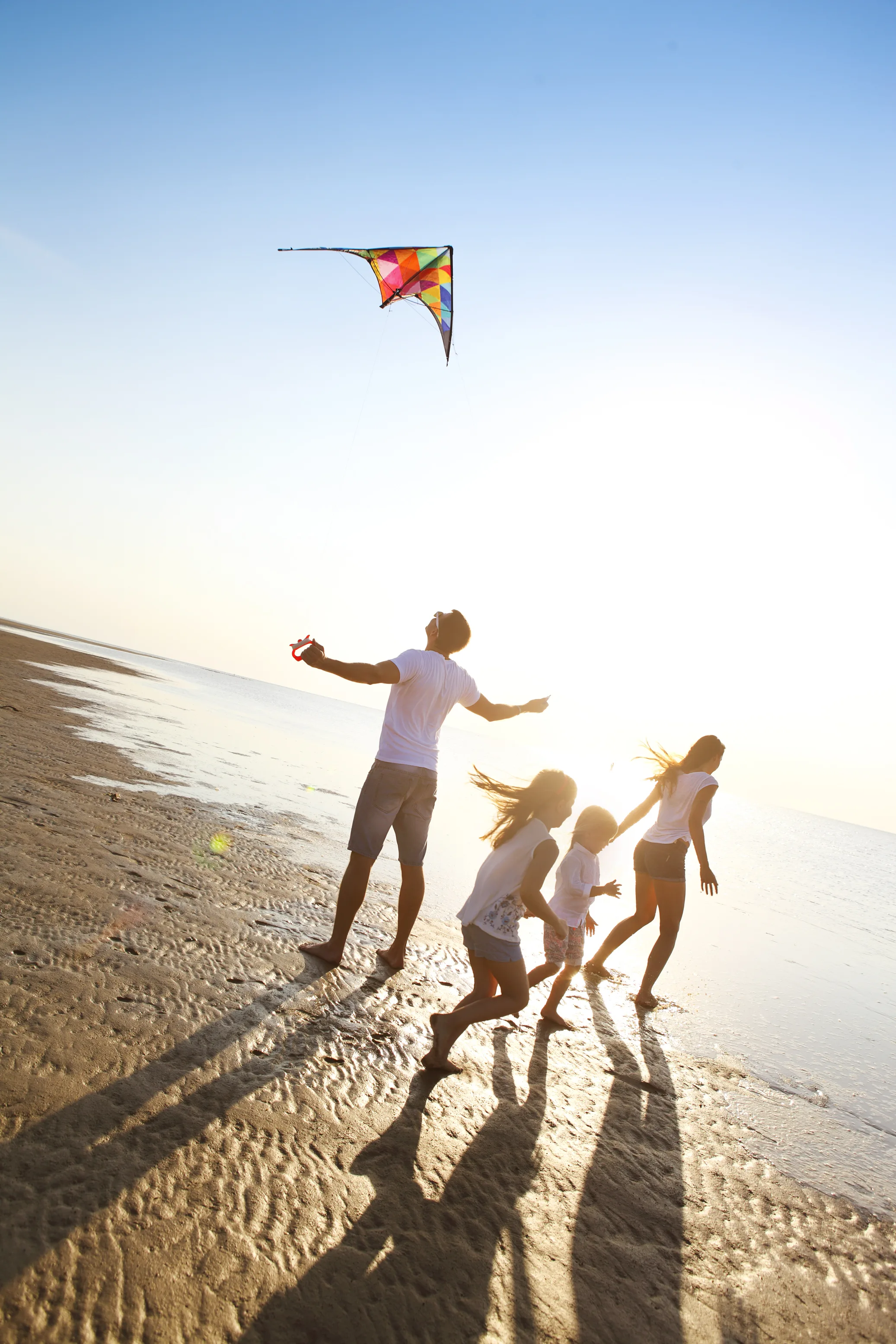 At what age can children be left at home alone during the school holidays?